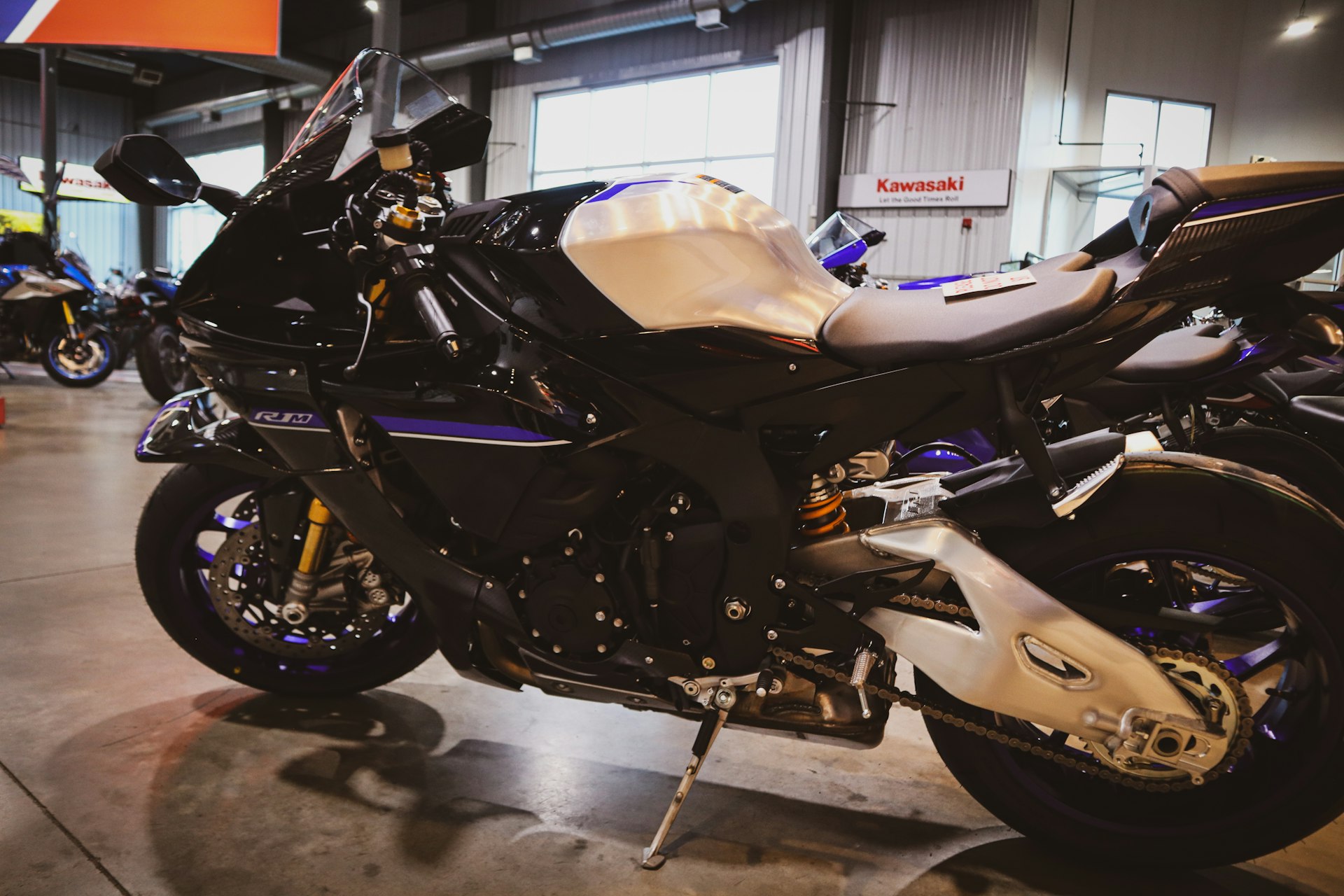 A black sport motorcycle parked indoors.